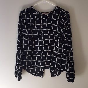 Black and white split open back blouse